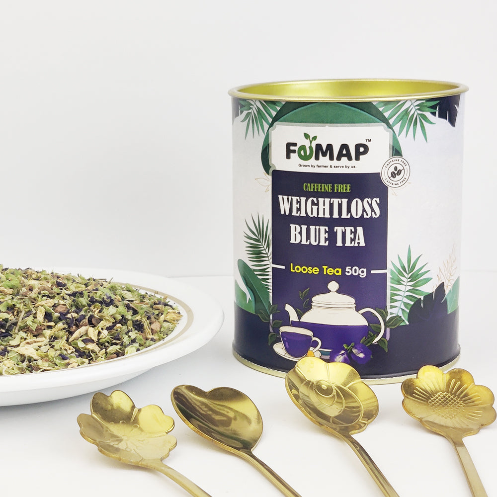 Femap Weightloss blue tea box with open blue tea blend decorated with shining spoon