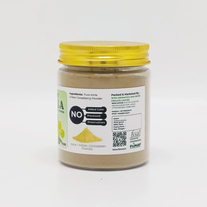 Jar of Indian gooseberry powder with a yellow lid on a white background