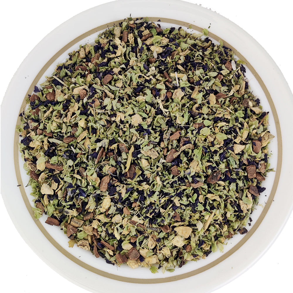 Close‑up of butterfly pea flower loose tea blend – vibrant blue petals and herbal texture