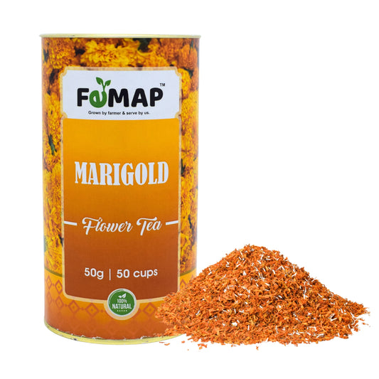 A box of FEMAP Marigold Flower Tea with a pile of dried marigold petals in front of it.