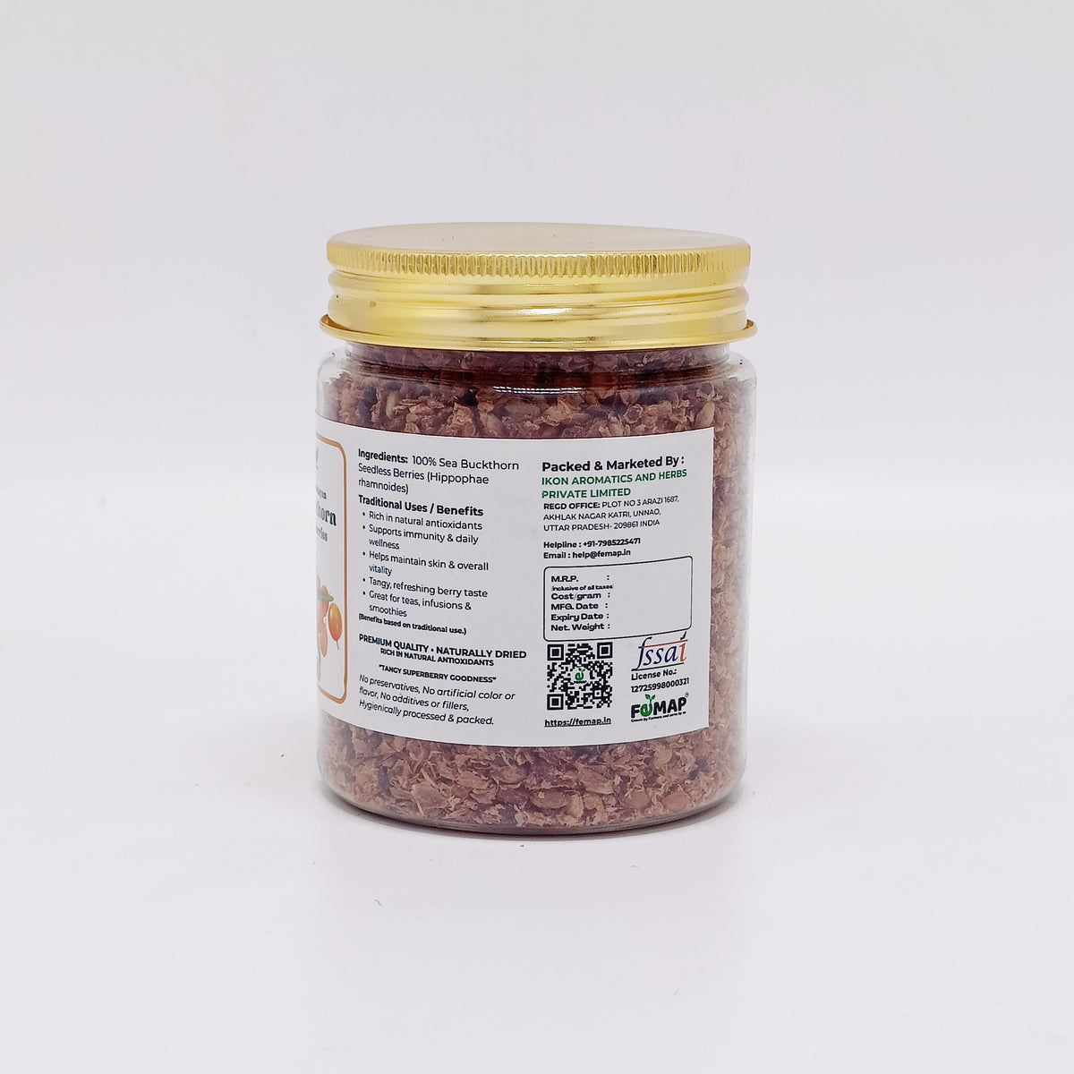 Jar of dried herbs with a gold lid on a white background