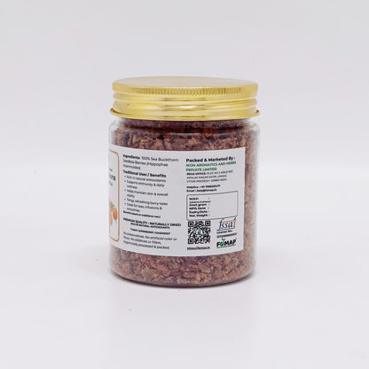 Jar of dried herbs with a gold lid on a white background