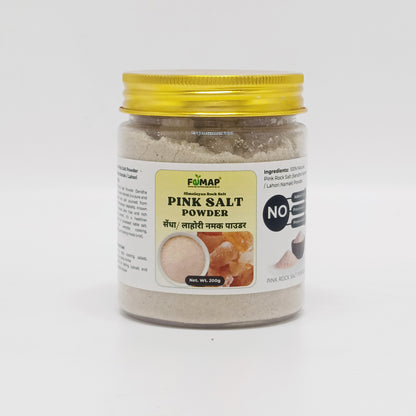Jar of pink salt powder with a yellow lid on a white background