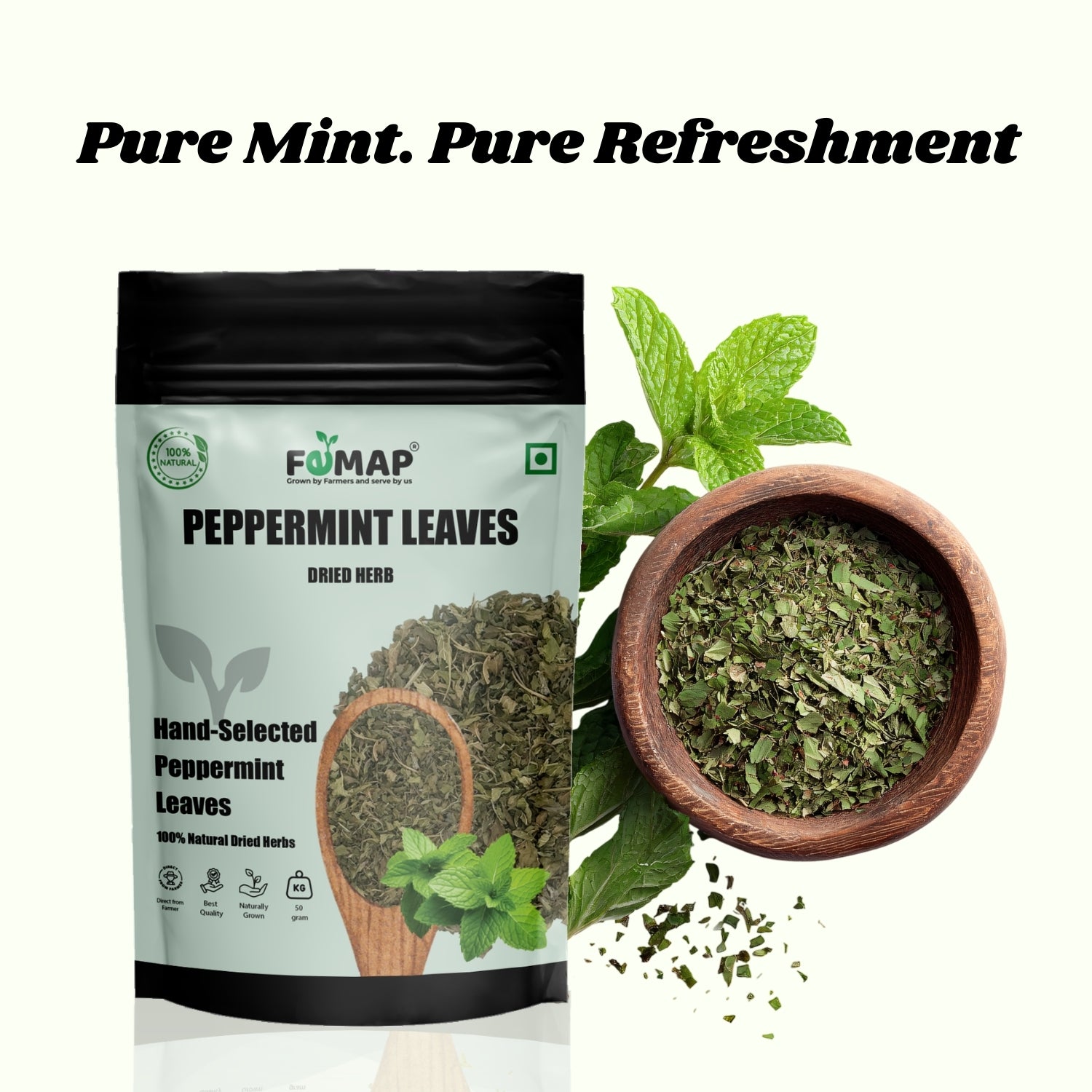 FEMAP peppermint leaves packaging with dried leaves in a wooden bowl and mint leaves on a white background.