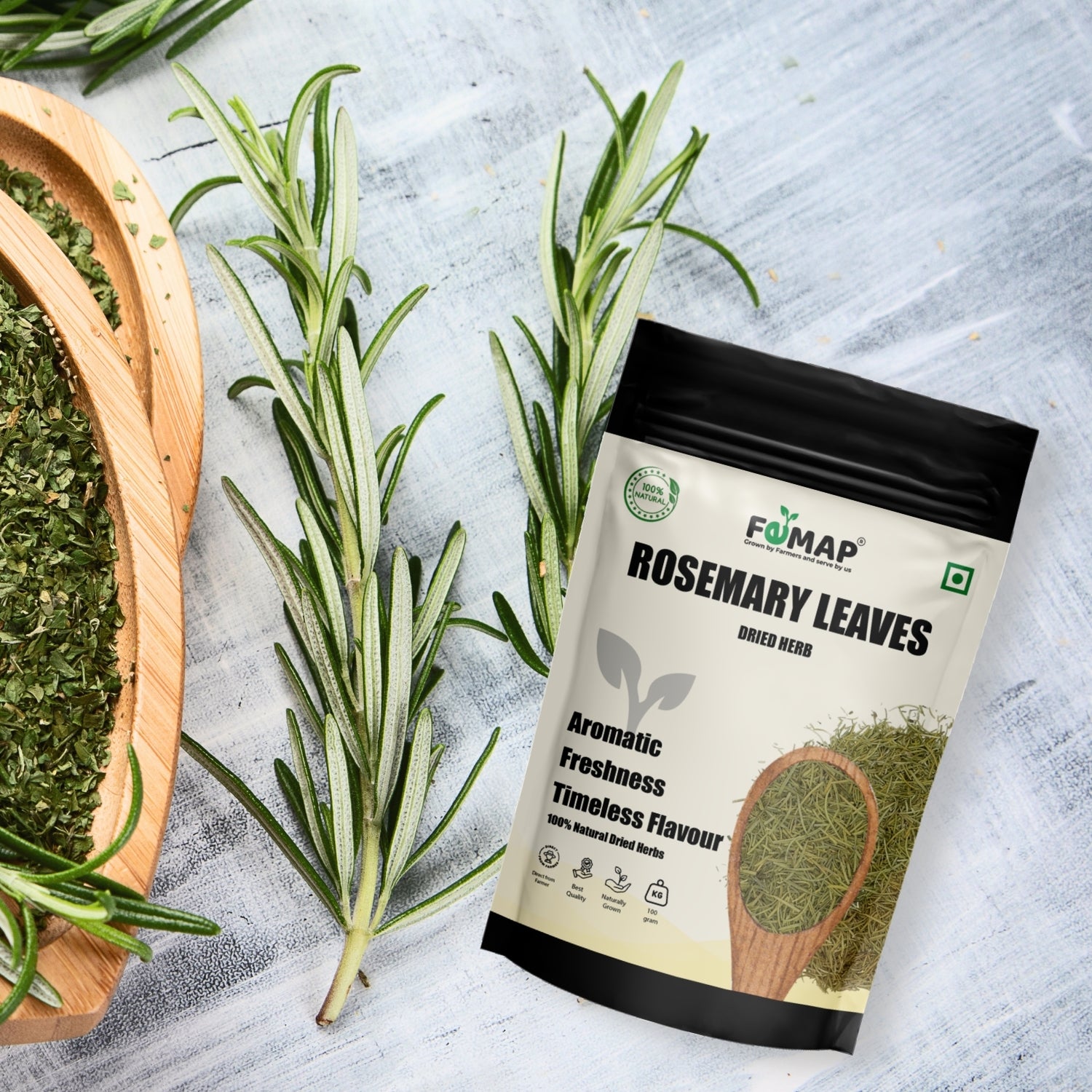 Rosemary leaves with a package labeled 'FEMAP Rosemary Leaves' on a textured surface.